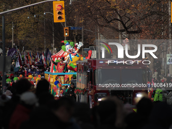 Participants take part in the annual Santa Claus Parade in Toronto, Ontario, Canada, on November 24, 2024. Thousands of people line the stre...