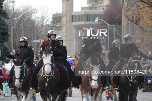 Participants take part in the annual Santa Claus Parade in Toronto, Ontario, Canada, on November 24, 2024. Thousands of people line the stre...