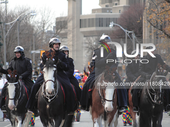 Participants take part in the annual Santa Claus Parade in Toronto, Ontario, Canada, on November 24, 2024. Thousands of people line the stre...