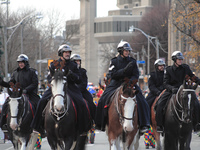 Participants take part in the annual Santa Claus Parade in Toronto, Ontario, Canada, on November 24, 2024. Thousands of people line the stre...