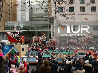 A person dressed as Santa Claus participates in the annual Santa Claus Parade in Toronto, Ontario, Canada, on November 24, 2024. Thousands o...