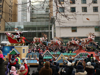 A person dressed as Santa Claus participates in the annual Santa Claus Parade in Toronto, Ontario, Canada, on November 24, 2024. Thousands o...