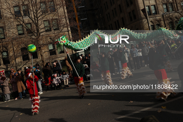 Participants take part in the annual Santa Claus Parade in Toronto, Ontario, Canada, on November 24, 2024. Thousands of people line the stre...