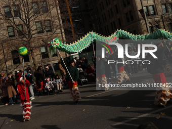 Participants take part in the annual Santa Claus Parade in Toronto, Ontario, Canada, on November 24, 2024. Thousands of people line the stre...