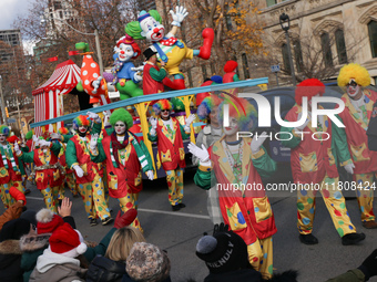 Participants take part in the annual Santa Claus Parade in Toronto, Ontario, Canada, on November 24, 2024. Thousands of people line the stre...