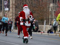 Participants take part in the annual Santa Claus Parade in Toronto, Ontario, Canada, on November 24, 2024. Thousands of people line the stre...