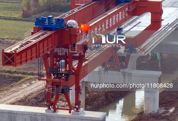 Workers work on the Nanjing-Huai'an Intercity Railway in Huai'an, Jiangsu province, China, on November 24, 2024. 