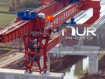 Workers work on the Nanjing-Huai'an Intercity Railway in Huai'an, Jiangsu province, China, on November 24, 2024. (