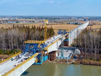 Workers work on the Nanjing-Huai'an Intercity Railway in Huai'an, Jiangsu province, China, on November 24, 2024. (