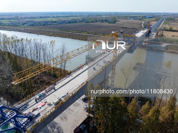 Workers work on the Nanjing-Huai'an Intercity Railway in Huai'an, Jiangsu province, China, on November 24, 2024. 