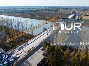 Workers work on the Nanjing-Huai'an Intercity Railway in Huai'an, Jiangsu province, China, on November 24, 2024. (