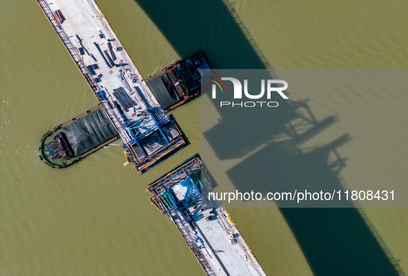 Workers work on the Nanjing-Huai'an Intercity Railway in Huai'an, Jiangsu province, China, on November 24, 2024. 