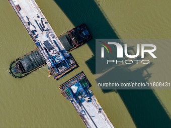 Workers work on the Nanjing-Huai'an Intercity Railway in Huai'an, Jiangsu province, China, on November 24, 2024. (