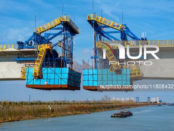 Workers work on the Nanjing-Huai'an Intercity Railway in Huai'an, Jiangsu province, China, on November 24, 2024. (