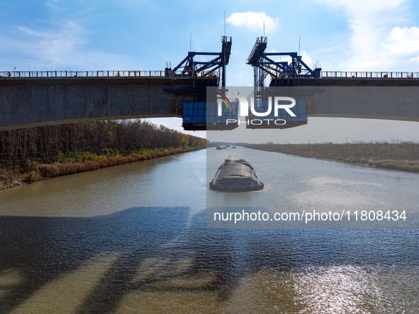 Workers work on the Nanjing-Huai'an Intercity Railway in Huai'an, Jiangsu province, China, on November 24, 2024. 