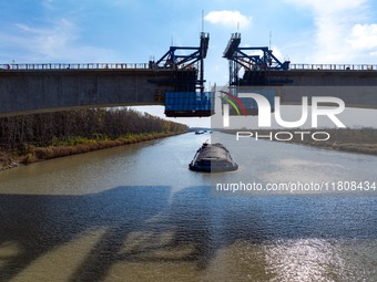 Workers work on the Nanjing-Huai'an Intercity Railway in Huai'an, Jiangsu province, China, on November 24, 2024. (