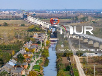 Workers work on the Nanjing-Huai'an Intercity Railway in Huai'an, Jiangsu province, China, on November 24, 2024. (