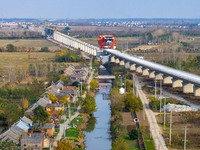 Workers work on the Nanjing-Huai'an Intercity Railway in Huai'an, Jiangsu province, China, on November 24, 2024. (