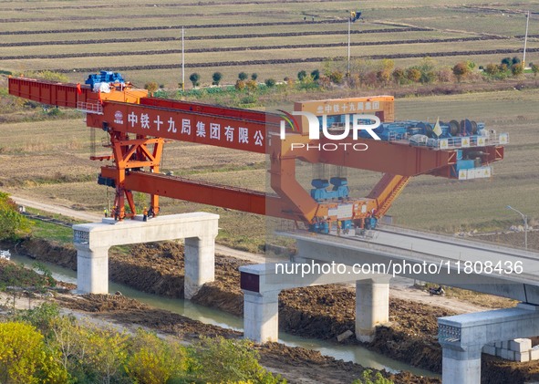 Workers work on the Nanjing-Huai'an Intercity Railway in Huai'an, Jiangsu province, China, on November 24, 2024. 