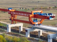 Workers work on the Nanjing-Huai'an Intercity Railway in Huai'an, Jiangsu province, China, on November 24, 2024. (