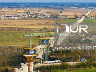 Workers work on the Nanjing-Huai'an Intercity Railway in Huai'an, Jiangsu province, China, on November 24, 2024. (