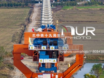 Workers work on the Nanjing-Huai'an Intercity Railway in Huai'an, Jiangsu province, China, on November 24, 2024. (