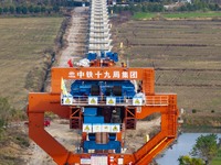 Workers work on the Nanjing-Huai'an Intercity Railway in Huai'an, Jiangsu province, China, on November 24, 2024. (