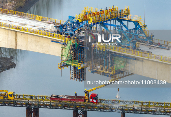 Workers work on the Nanjing-Huai'an Intercity Railway in Huai'an, Jiangsu province, China, on November 24, 2024. 