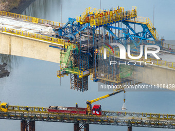 Workers work on the Nanjing-Huai'an Intercity Railway in Huai'an, Jiangsu province, China, on November 24, 2024. (