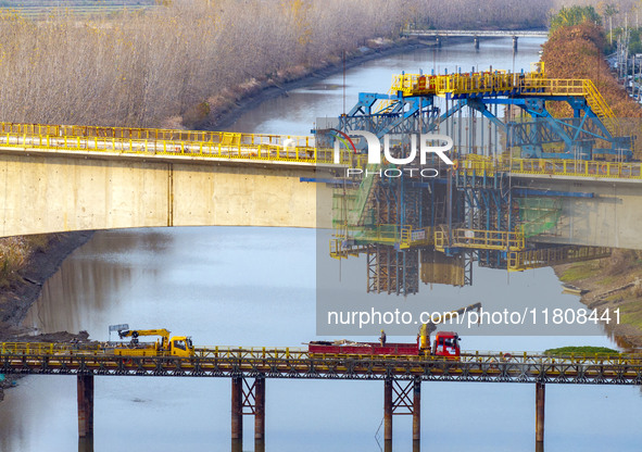 Workers work on the Nanjing-Huai'an Intercity Railway in Huai'an, Jiangsu province, China, on November 24, 2024. 