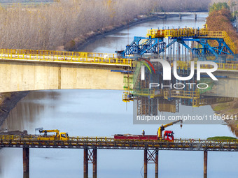 Workers work on the Nanjing-Huai'an Intercity Railway in Huai'an, Jiangsu province, China, on November 24, 2024. (