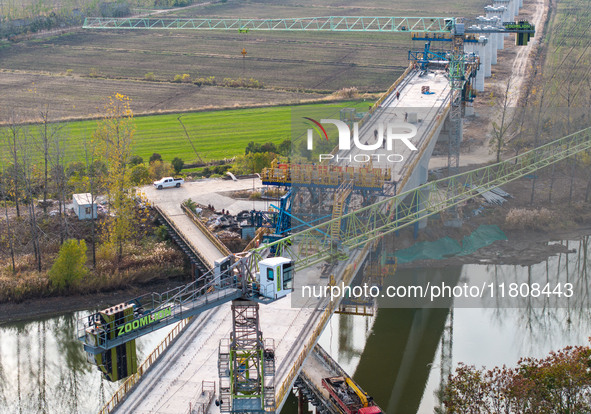 Workers work on the Nanjing-Huai'an Intercity Railway in Huai'an, Jiangsu province, China, on November 24, 2024. 