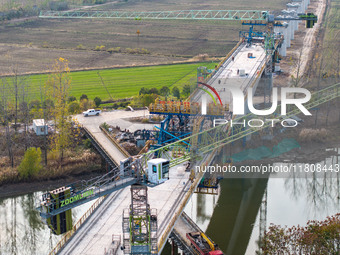 Workers work on the Nanjing-Huai'an Intercity Railway in Huai'an, Jiangsu province, China, on November 24, 2024. (