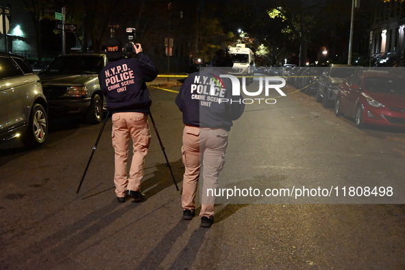 The NYPD Crime Scene Unit investigates the scene and places evidence markers where one man is killed and another man is injured in a shootin...