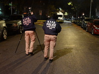 The NYPD Crime Scene Unit investigates the scene and places evidence markers where one man is killed and another man is injured in a shootin...