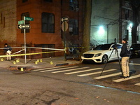 The NYPD Crime Scene Unit investigates the scene and places evidence markers where one man is killed and another man is injured in a shootin...