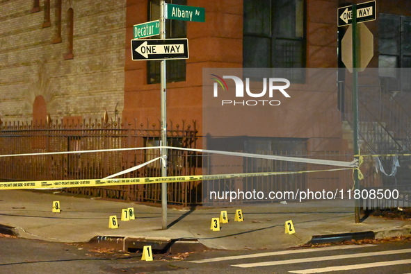 The NYPD Crime Scene Unit investigates the scene and places evidence markers where one man is killed and another man is injured in a shootin...