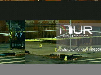 The NYPD Crime Scene Unit investigates the scene and places evidence markers where one man is killed and another man is injured in a shootin...