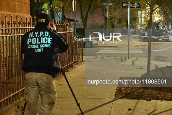 The NYPD Crime Scene Unit investigates the scene and places evidence markers where one man is killed and another man is injured in a shootin...