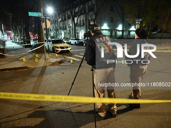 The NYPD Crime Scene Unit investigates the scene and places evidence markers where one man is killed and another man is injured in a shootin...