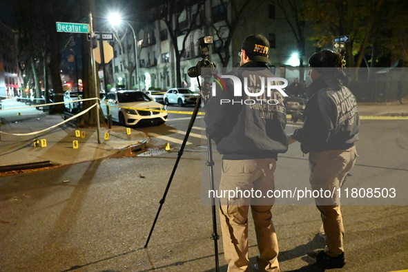 The NYPD Crime Scene Unit investigates the scene and places evidence markers where one man is killed and another man is injured in a shootin...