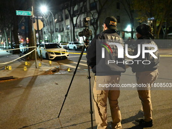 The NYPD Crime Scene Unit investigates the scene and places evidence markers where one man is killed and another man is injured in a shootin...