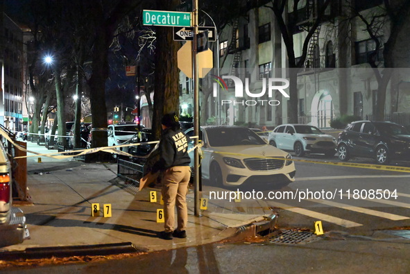 The NYPD Crime Scene Unit investigates the scene and places evidence markers where one man is killed and another man is injured in a shootin...