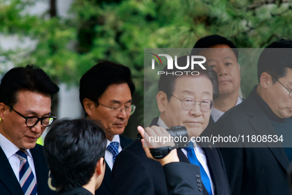 Lee Jae-myung (center), leader of the Democratic Party of Korea, leaves the Seoul Central District Court in Seocho-gu, Seoul, on November 25...