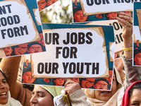 Female workers of the Jammu and Kashmir Pradesh Congress Committee (JKPCC) hold placards during a protest demanding the restoration of state...