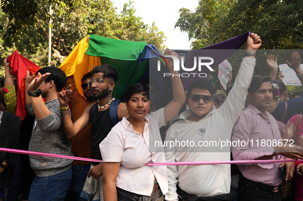 Members of the LGBT community hold the rainbow flag during the pride march in New Delhi, India, on November 24, 2024. 