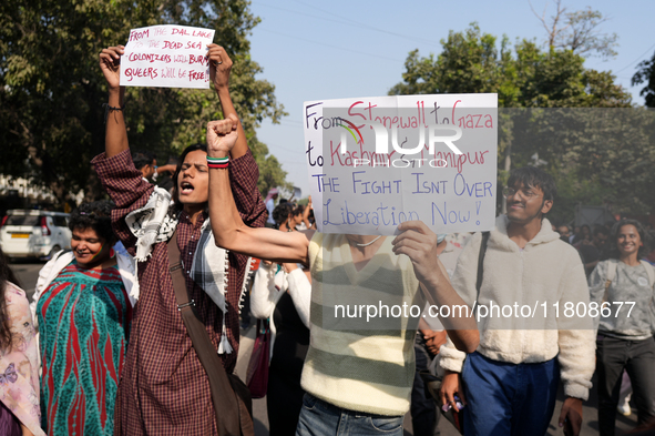 Supporters of the LGBT community hold placards in support of Kashmir and Palestine during the pride march in New Delhi, India, on November 2...