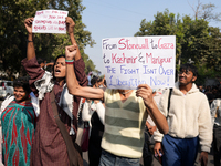 Supporters of the LGBT community hold placards in support of Kashmir and Palestine during the pride march in New Delhi, India, on November 2...