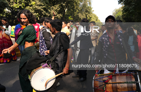 Members of the LGBT community dance on drums during the pride march in New Delhi, India, on November 24, 2024. 