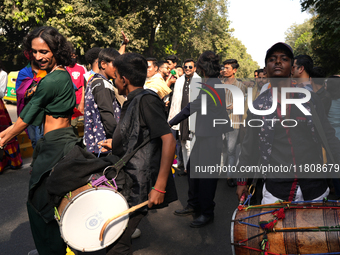 Members of the LGBT community dance on drums during the pride march in New Delhi, India, on November 24, 2024. (